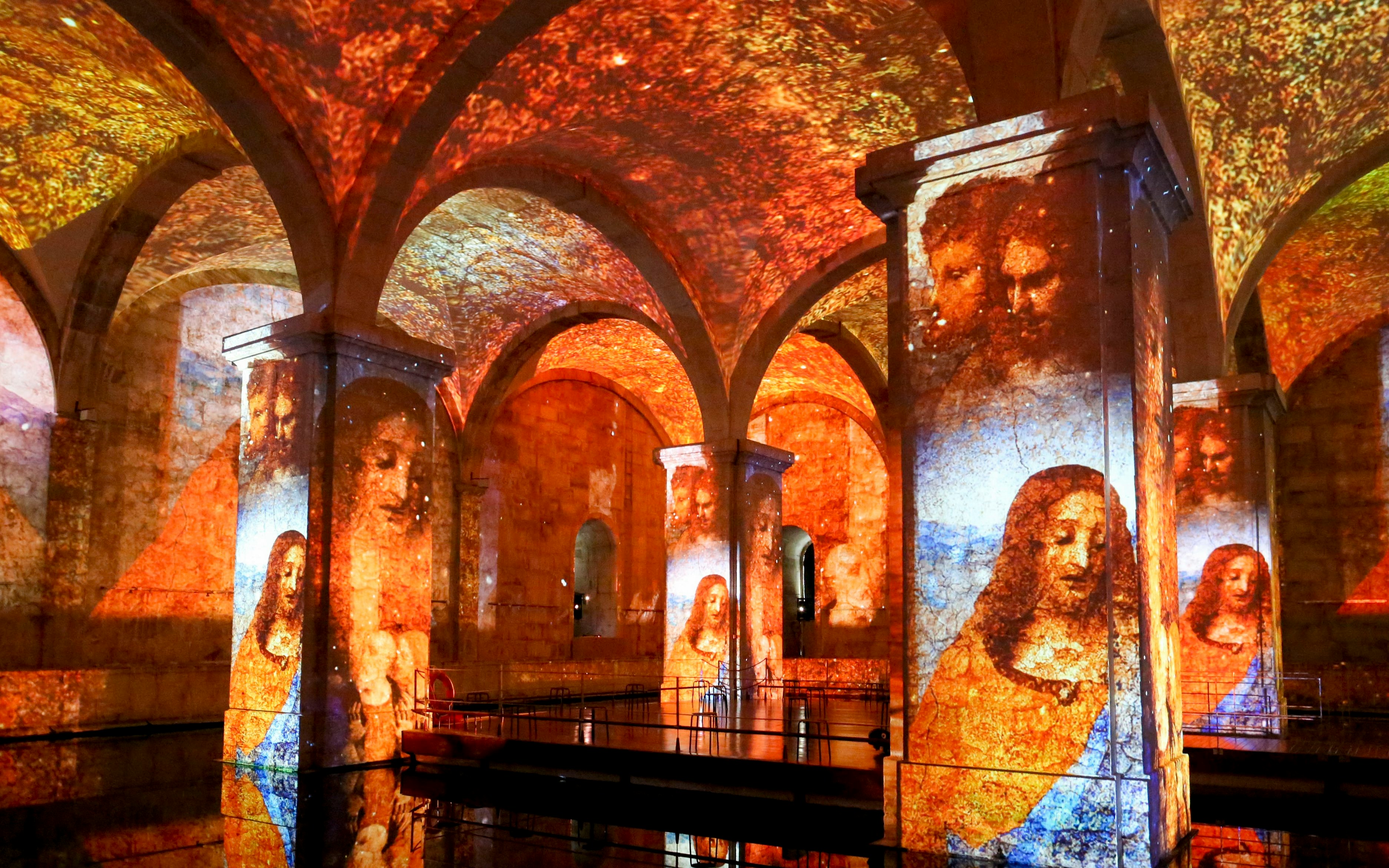 Visitors at Immersivus Gallery Lisbon viewing Michelangelo and Da Vinci light show.