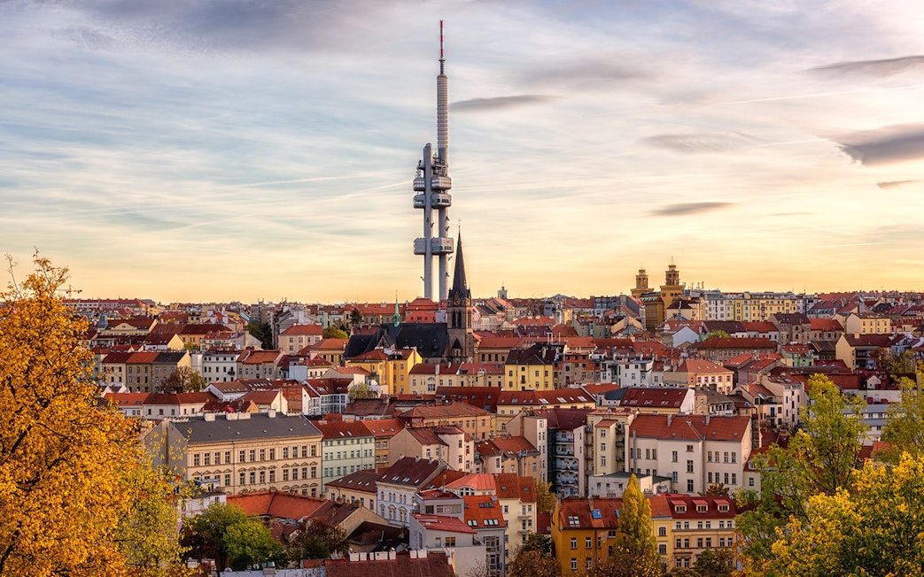 Prague skyline with Žižkov Television Tower and historic buildings.