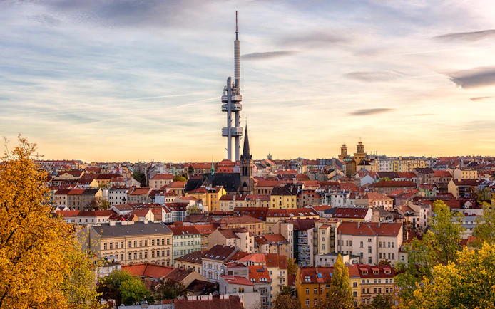 Prague skyline with Žižkov Television Tower and historic buildings.