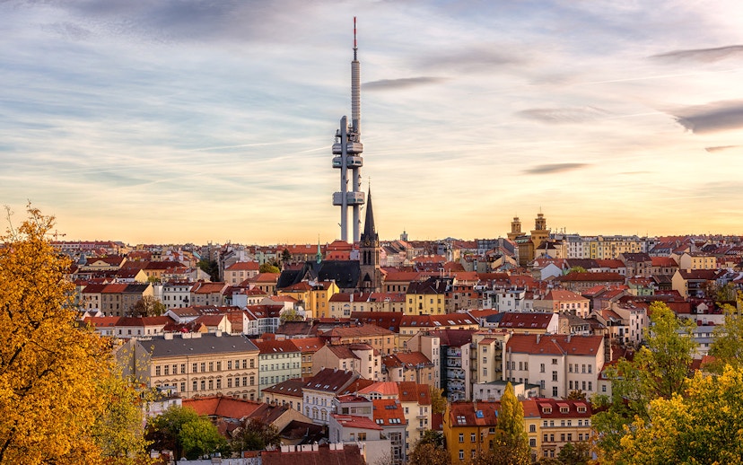 Prague skyline with Žižkov Television Tower and historic buildings.