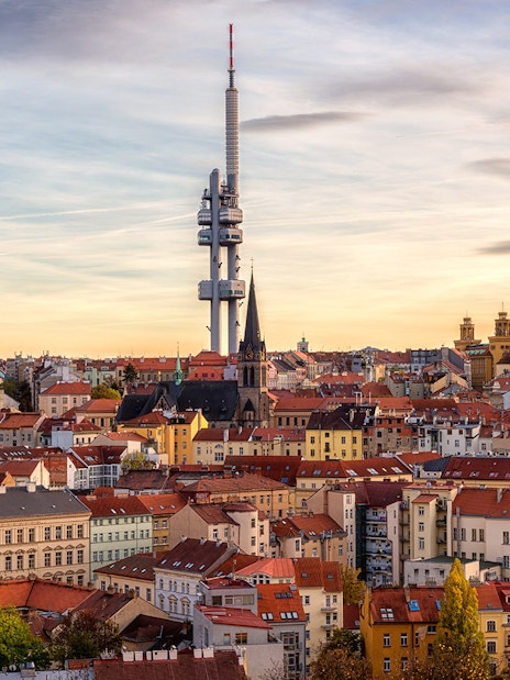 Prague skyline with Žižkov Television Tower and historic buildings.