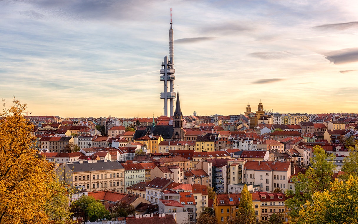 Prague skyline with Žižkov Television Tower and historic buildings.