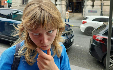 Person pondering during Liverpool Murder Mystery city exploration game.