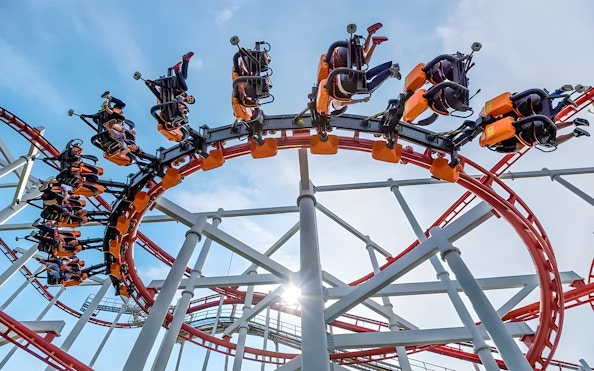 Roller coaster loop at Dream World Bangkok with riders upside down.