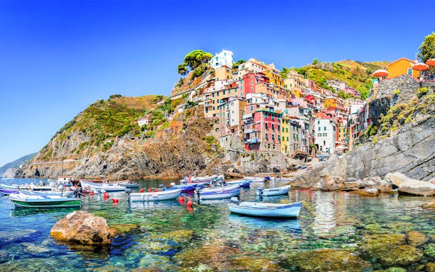 Boats in the harbor of a colorful fishing village, Cinque Terre, Italy.