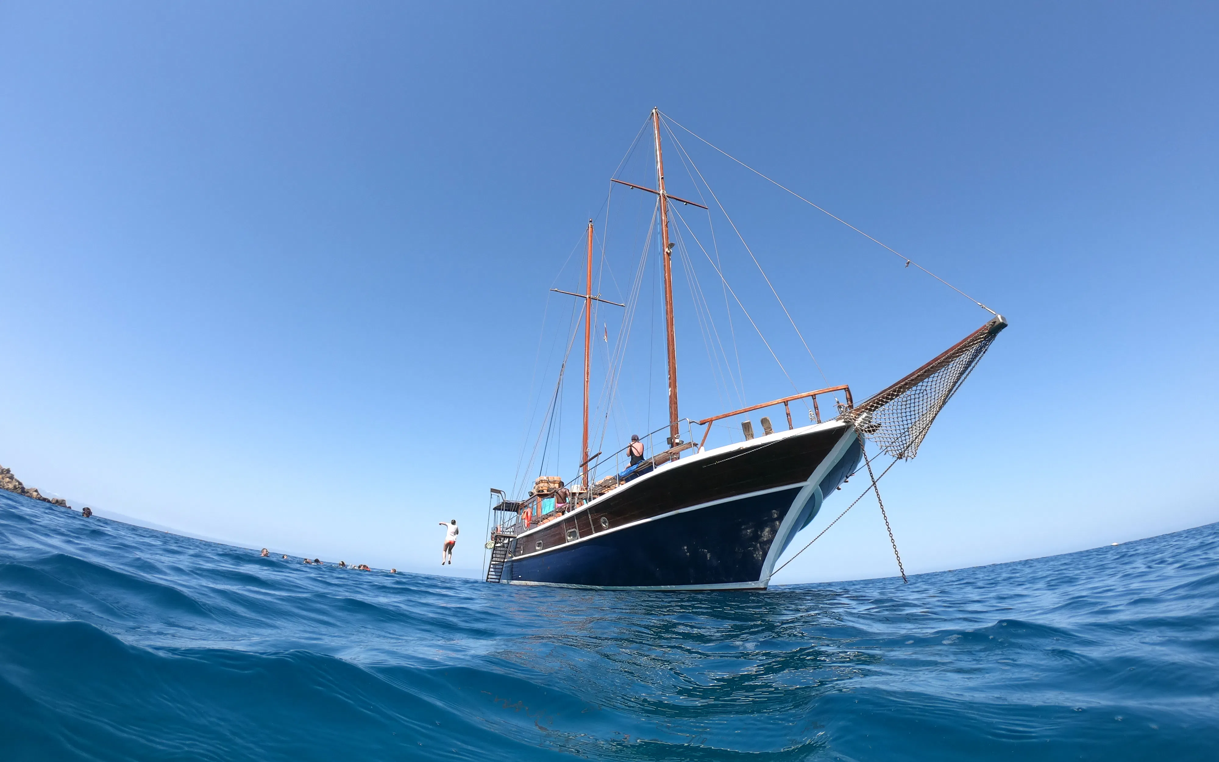 Sailing boat on the water during a cruise at Fernandes Gozo & Comino, Malta.