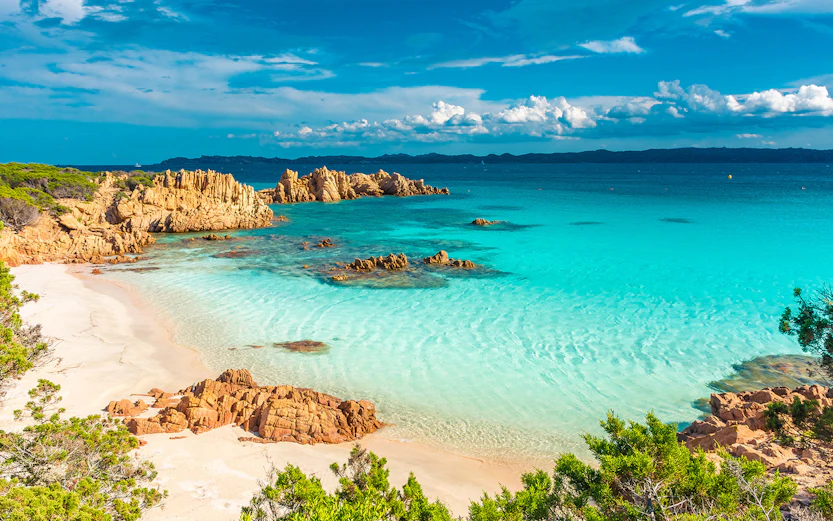 Turquoise waters and rocky coastline of La Maddalena, Sardinia.