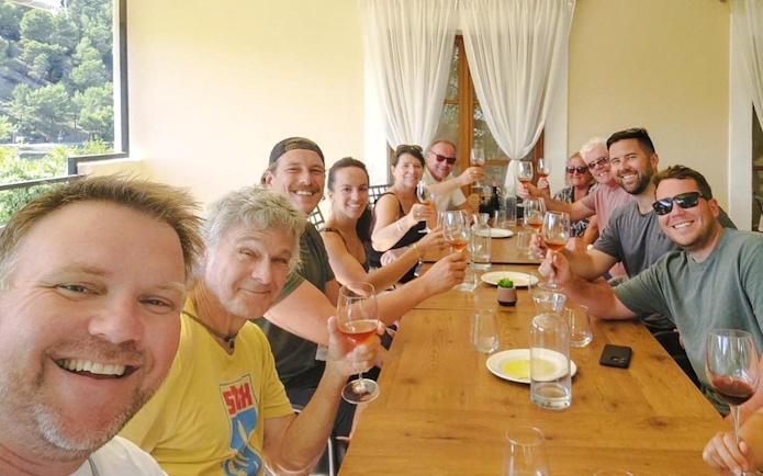 Guests enjoying wine tasting during Krka National Park day trip.