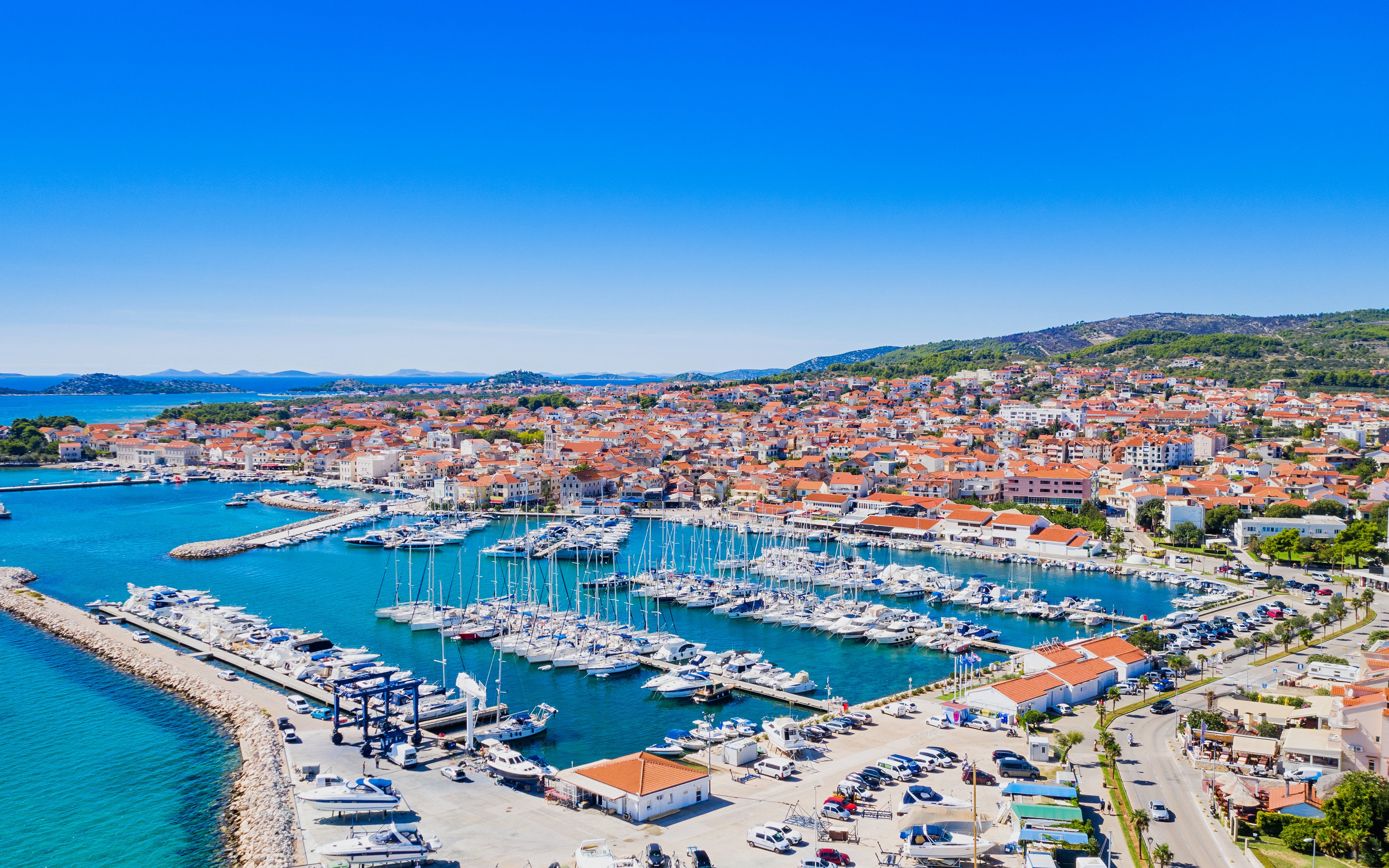 Aerial view of Vodice marina and turquoise Adriatic coastline, Croatia.