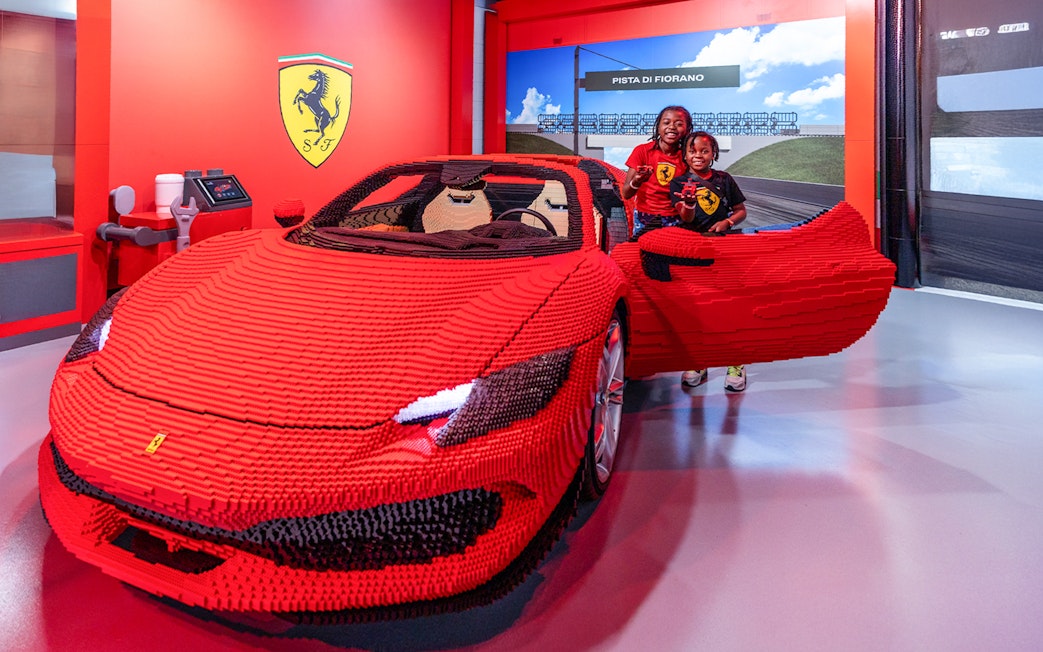 Ferrari GTS Lego model with children at Build and Race Test Zone, LEGOLAND Florida.