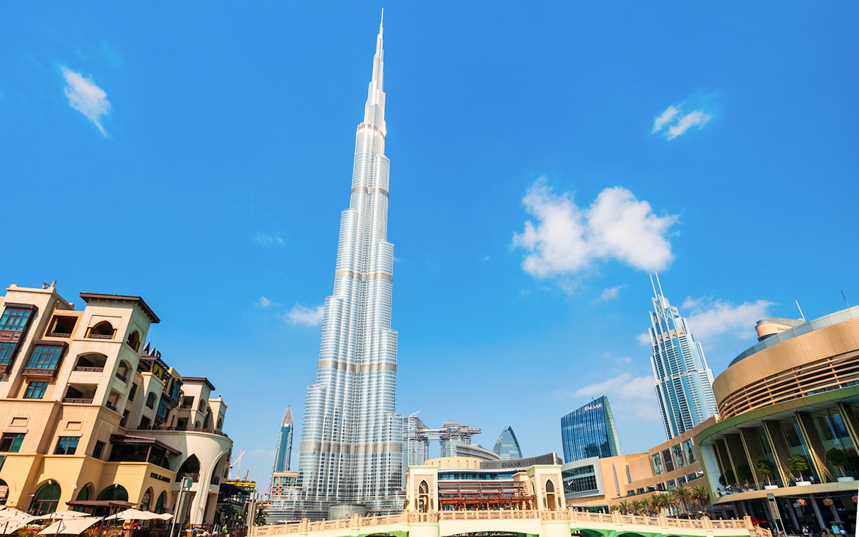 Burj Khalifa towering over Dubai cityscape on a clear day.
