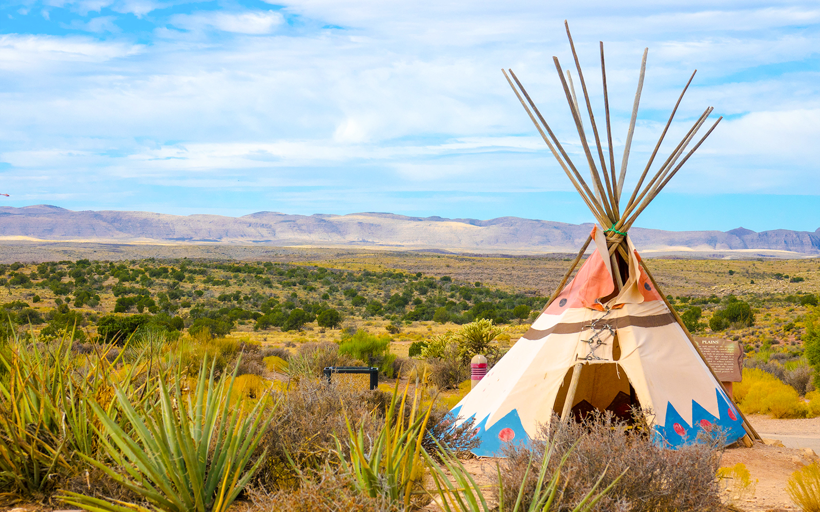 Indian tent set up at West Rim, Grand Canyon with scenic canyon views in the background.