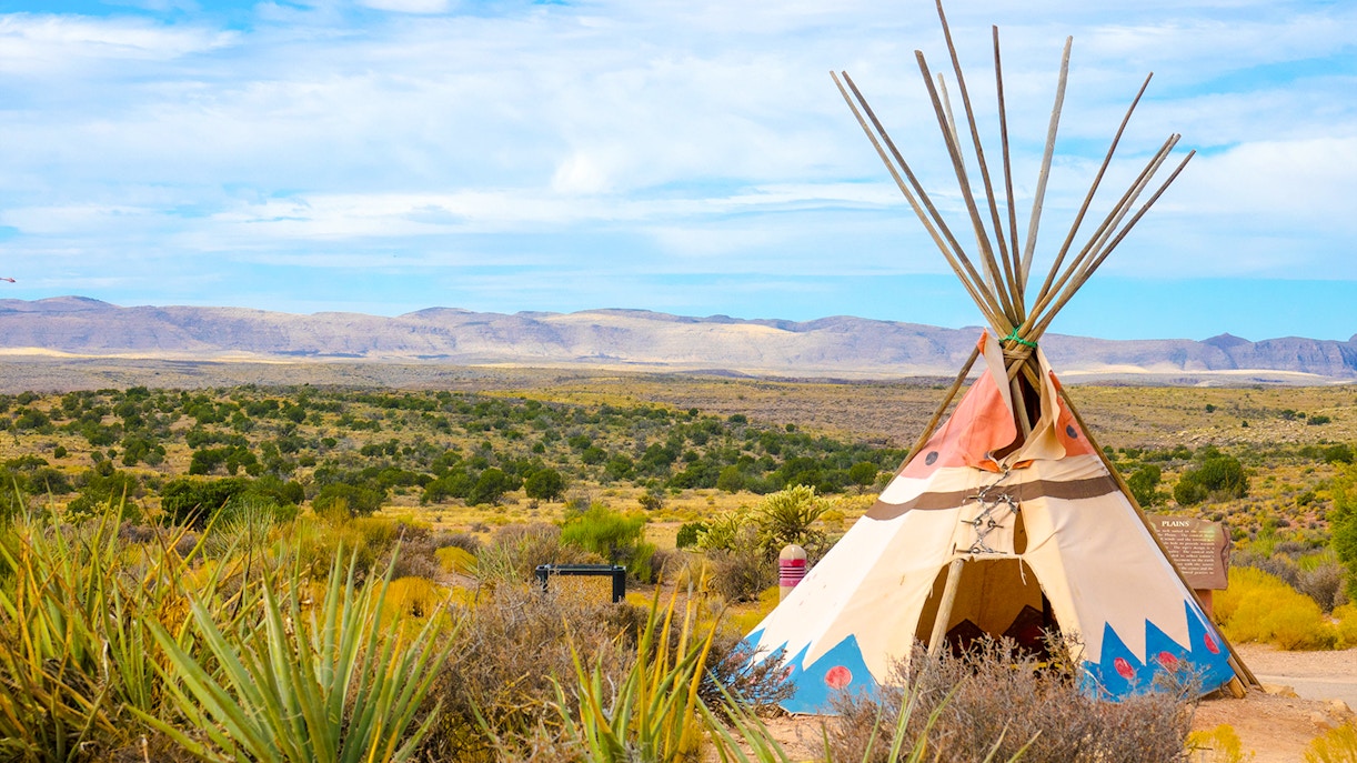 Indian tent set up at West Rim, Grand Canyon with scenic canyon views in the background.
