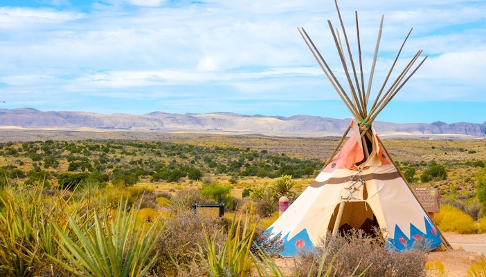 Indian tent set up at West Rim, Grand Canyon with scenic canyon views in the background.