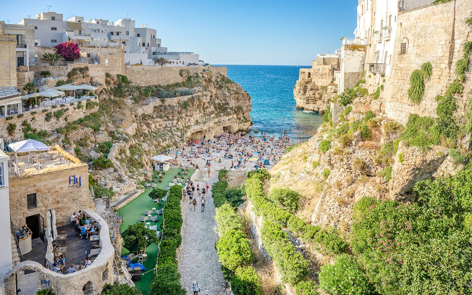 Lama Monachile beach with cliffs and sea view in Polignano a Mare, Italy.