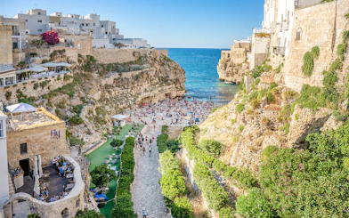 Lama Monachile beach with cliffs and sea view in Polignano a Mare, Italy.