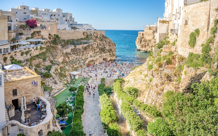 Lama Monachile beach with cliffs and sea view in Polignano a Mare, Italy.