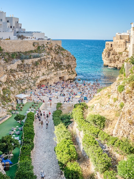 Lama Monachile beach with cliffs and sea view in Polignano a Mare, Italy.