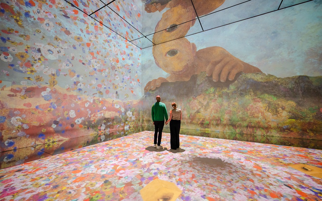 Visitors exploring immersive art installation at Frameless London.