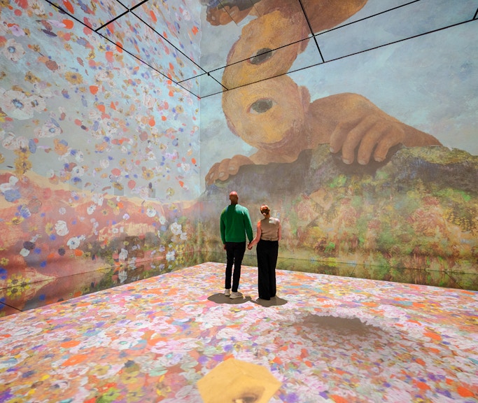 Visitors exploring immersive art installation at Frameless London.