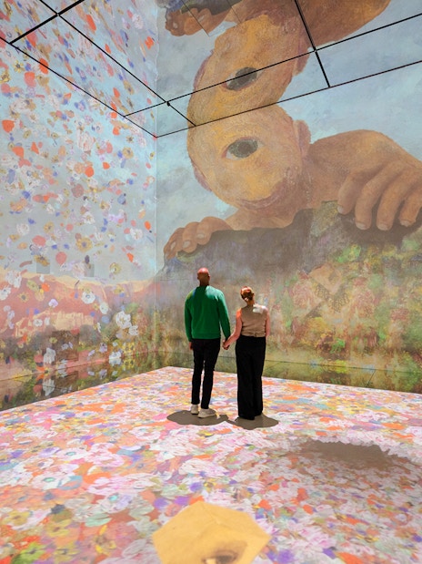 Visitors exploring immersive art installation at Frameless London.