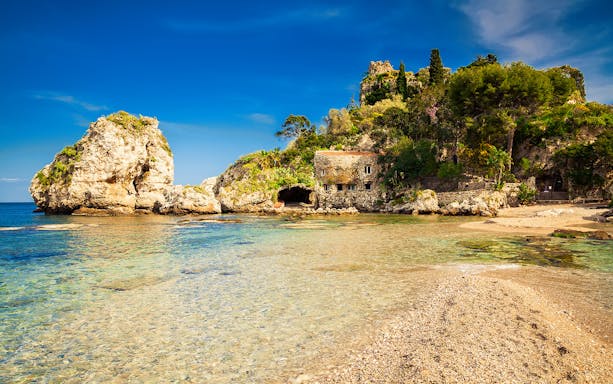 Excursion boat view of Isola Bella, Giardini Naxos, Taormina coastline.