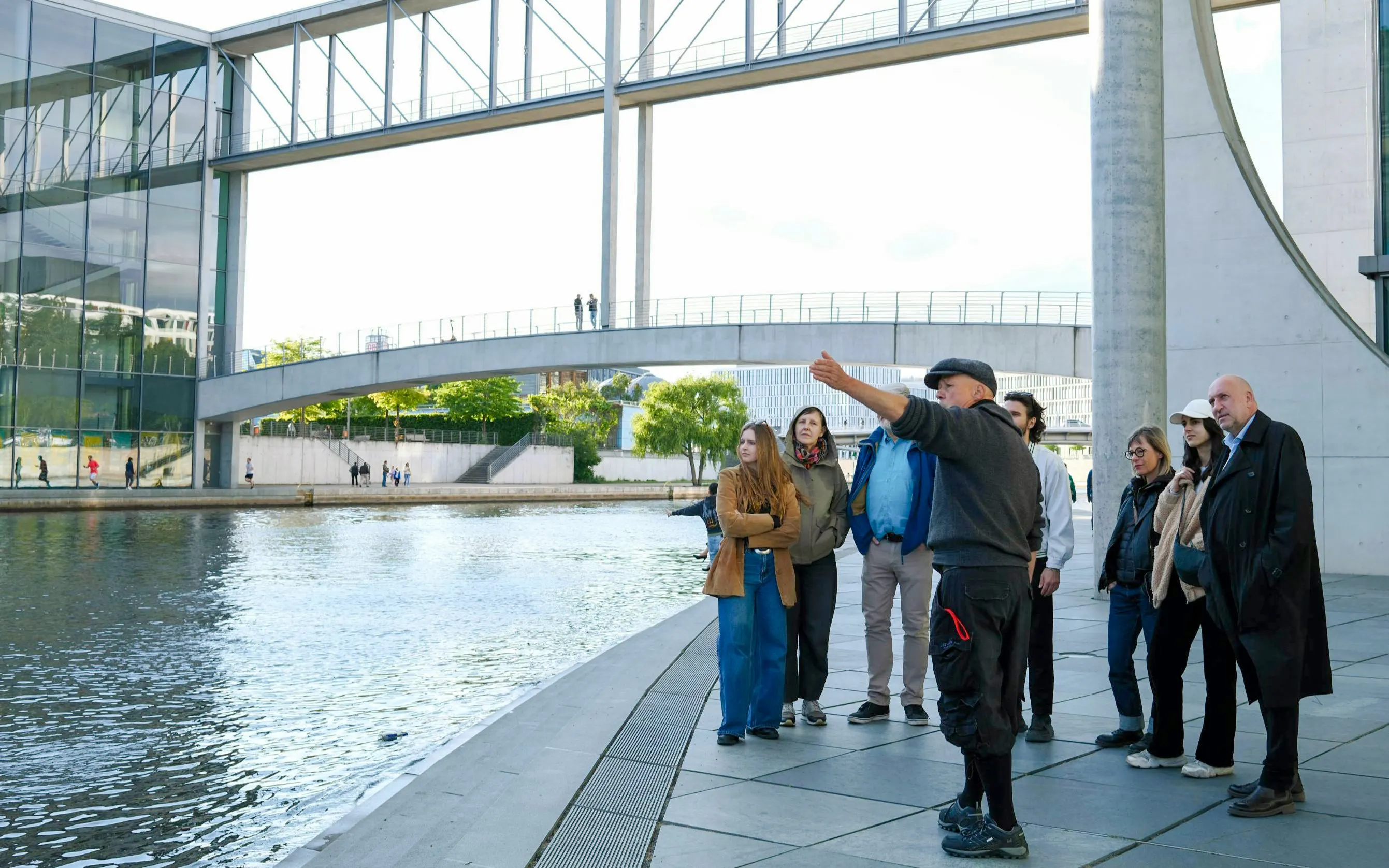 Tour group exploring the Government District near the Reichstag Dome, Berlin.