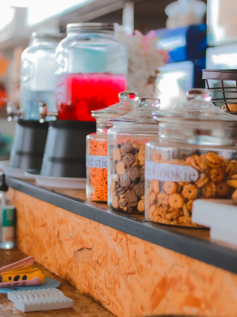 Food and drinks counter with beverage dispensers and cookie jars in Phuket.