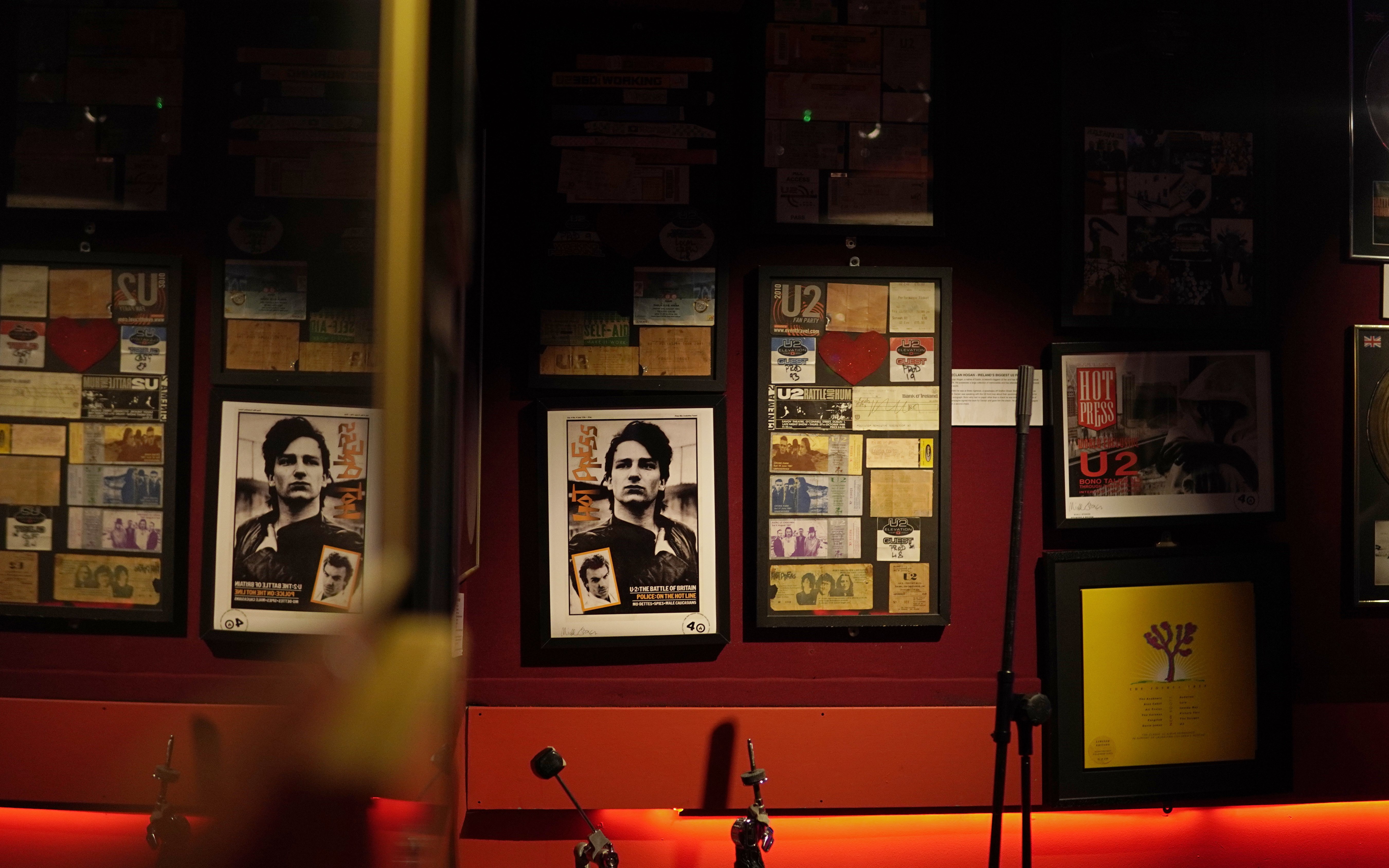 Irish Rock N Roll Museum Experience exhibit featuring U2 memorabilia and framed posters.