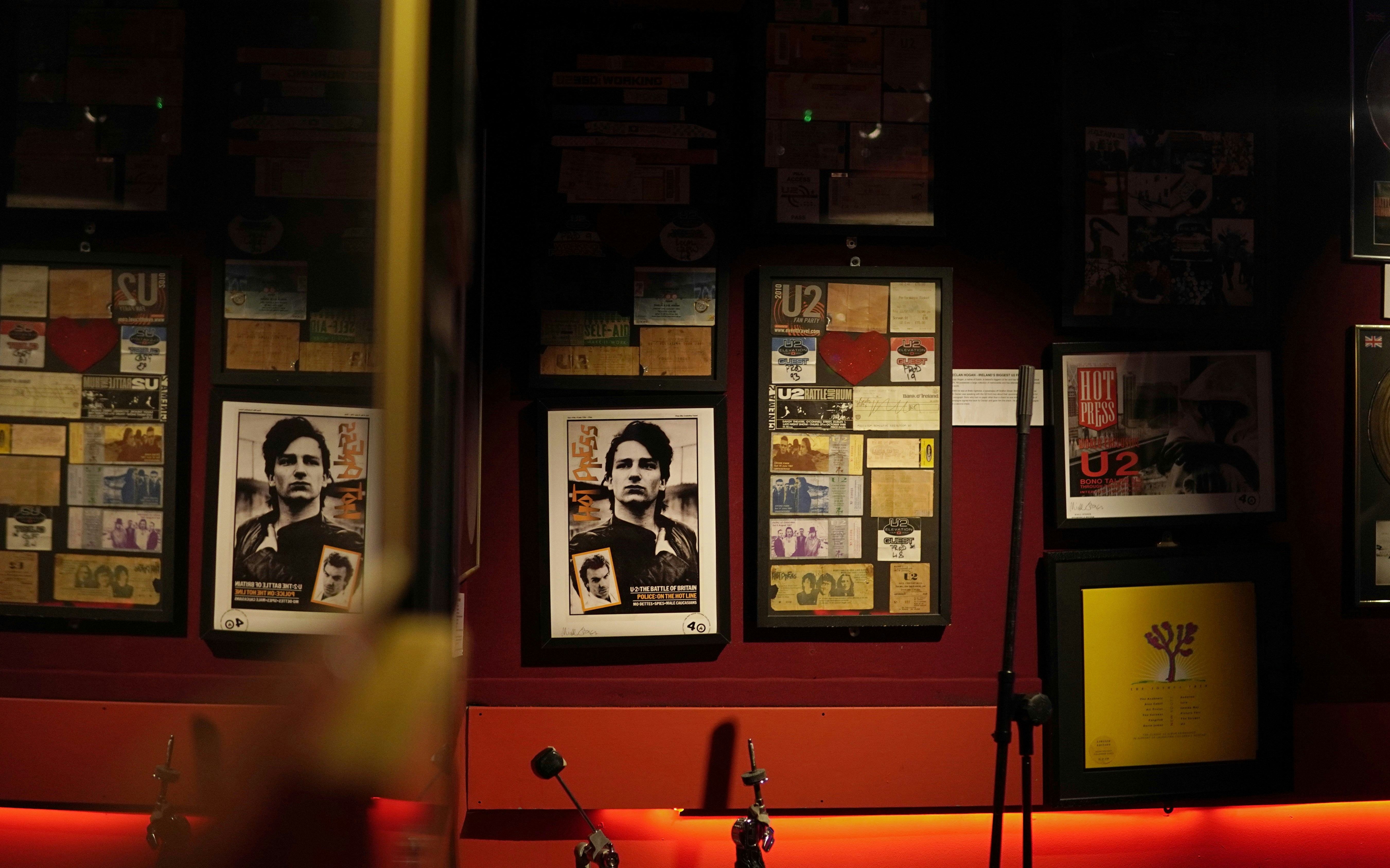 Irish Rock N Roll Museum Experience exhibit featuring U2 memorabilia and framed posters.