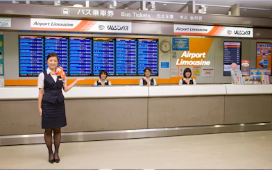 Airport Limousine counter staff at Narita Airport for bus transfers to Tokyo and Shinjuku.