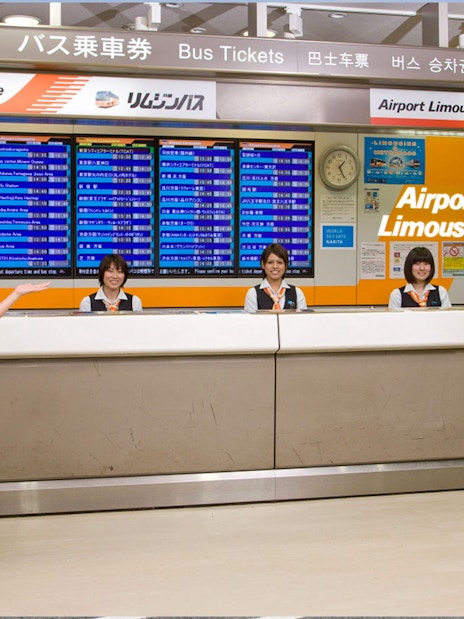 Airport Limousine counter staff at Narita Airport for bus transfers to Tokyo and Shinjuku.