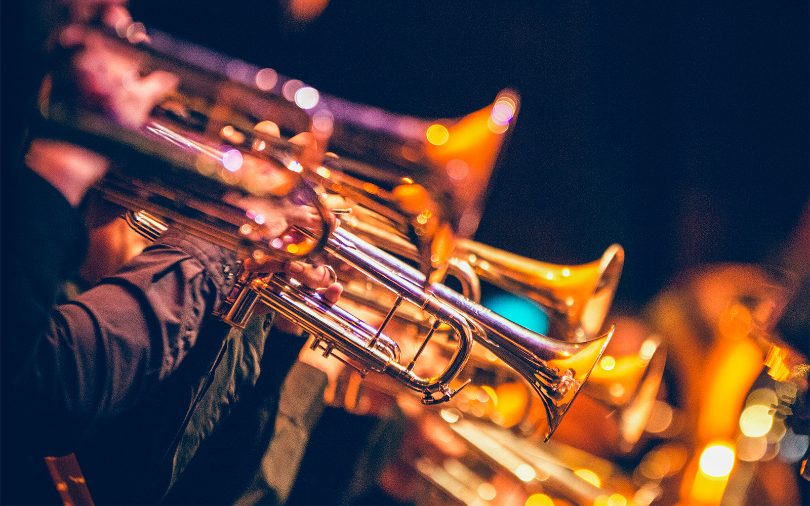 Musicians playing trumpets at a live jazz performance in Nice, France.