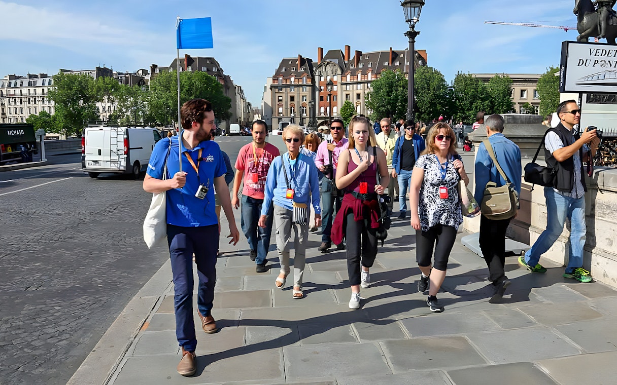 Guide leading a small group near Notre Dame, Paris.