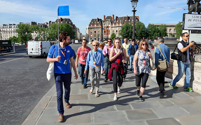 Guide leading a small group near Notre Dame, Paris.