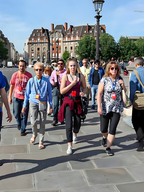 Guide leading a small group near Notre Dame, Paris.