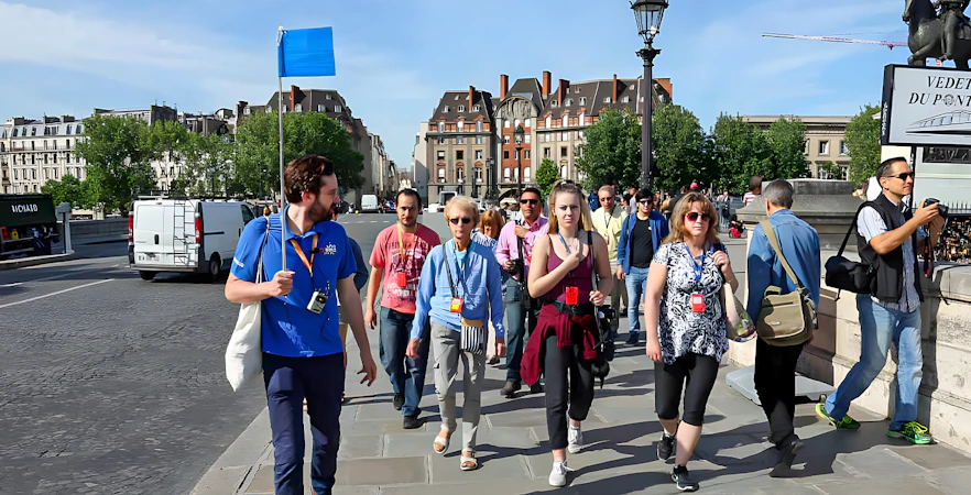 Guide leading a small group near Notre Dame, Paris.