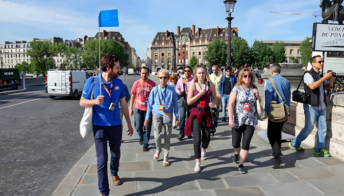 Guide with small group in front of saint chapelle, Paris