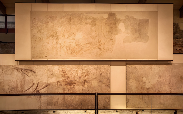 Paintings on display at Sinopie Museum, Pisa, showcasing historical fresco sketches.