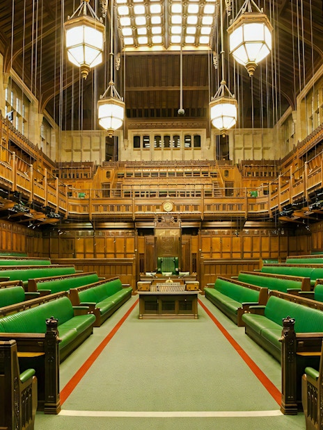 Chamber of the House of Commons with green benches, Houses of Parliament, London.