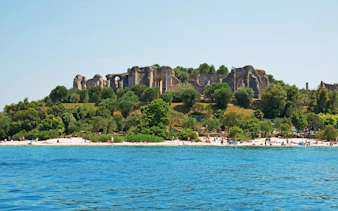 Ruins of Grotto of Catullus on Lake Garda shoreline, Sirmione, Italy.