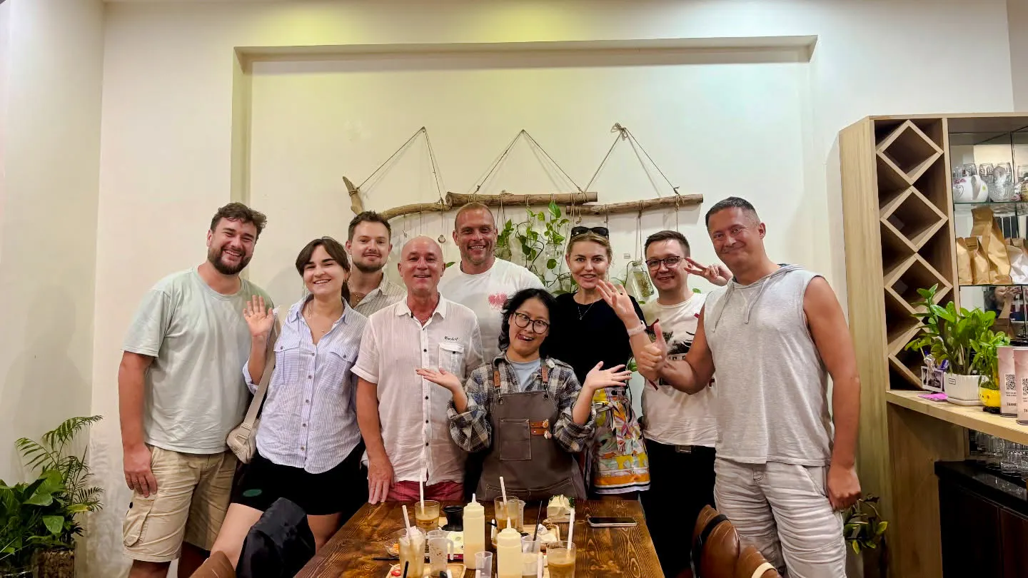Group enjoying DIY coffee-making class in Da Nang, Vietnam.