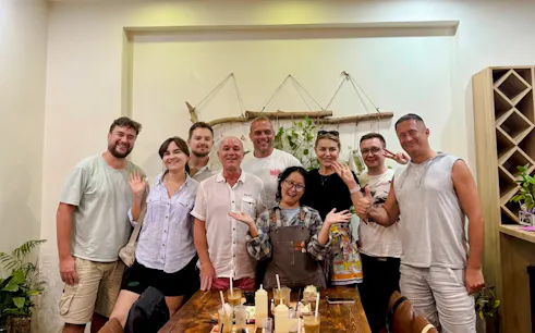 Group enjoying DIY coffee-making class in Da Nang, Vietnam.
