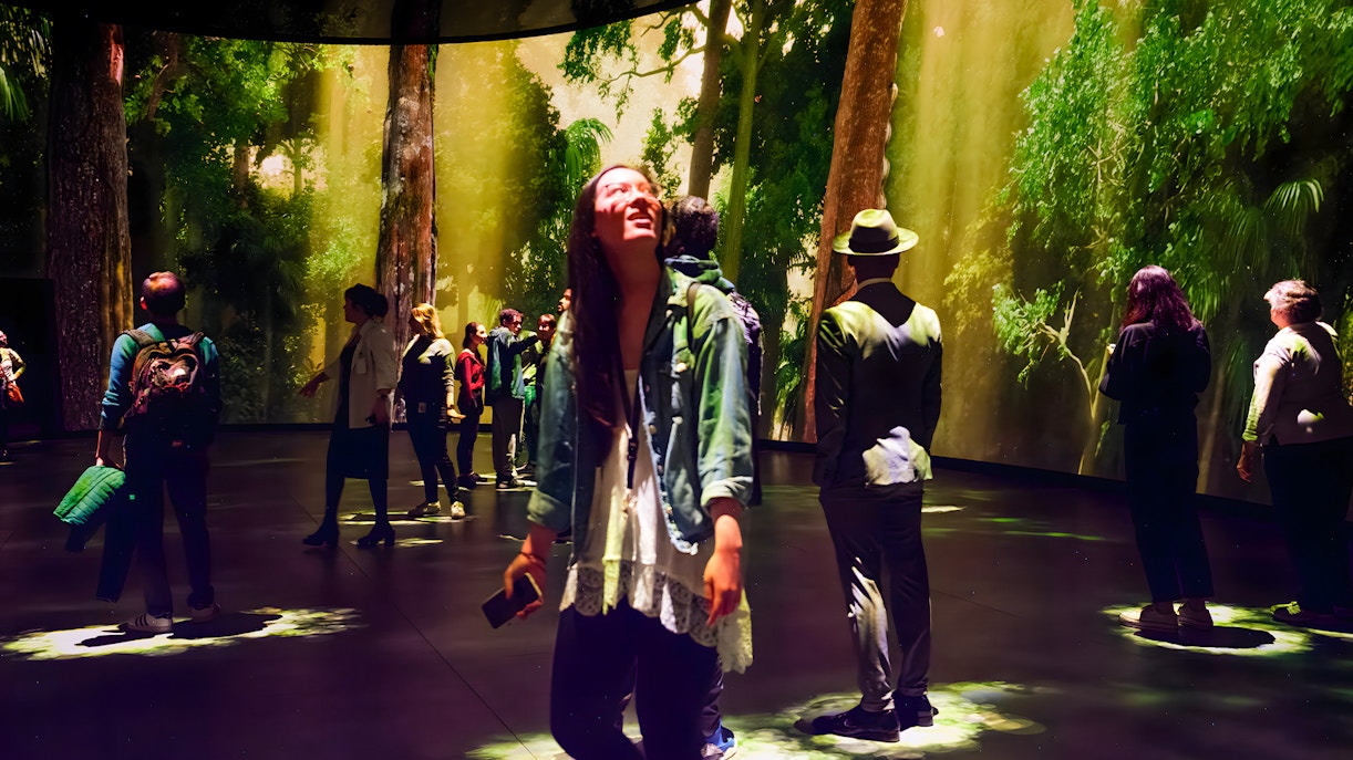 Visitors exploring the Invisible Worlds Exhibit at the American Museum of Natural History.