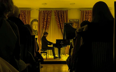 Pianist performing at evening Chopin concert, Chopin Gallery, Krakow.