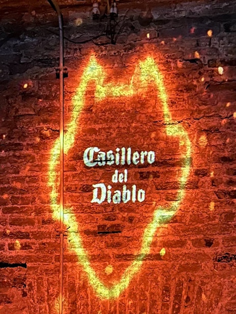 Casillero del Diablo logo projected on a brick wall with glowing effect