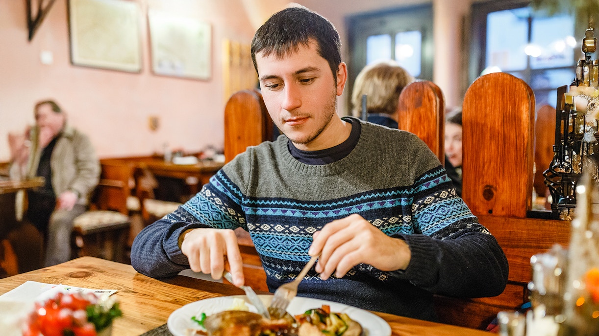 tourist having food before beer