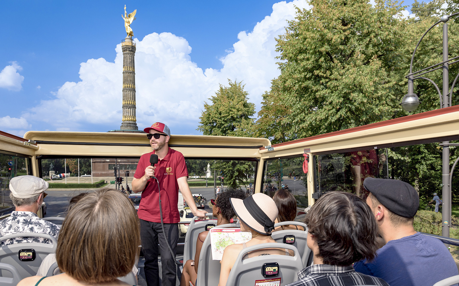 Participants on a Big Bus Berlin tour listen to a guide near the Victory Column.