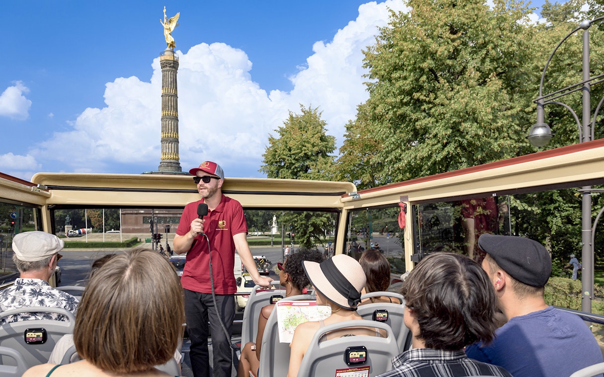 Participants on a Big Bus Berlin tour listen to a guide near the Victory Column.