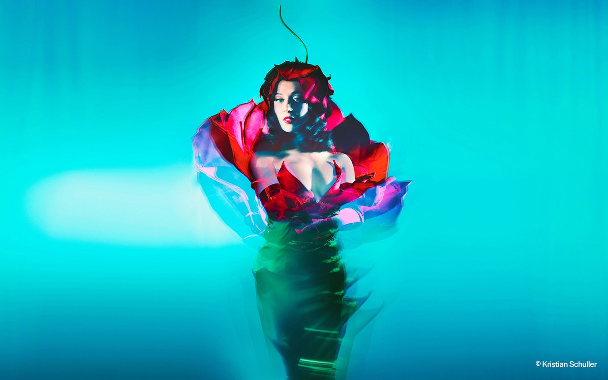 Performer in vibrant costume at BLINDED by DELIGHT Grand Show, Friedrichstadt Palast, Berlin.